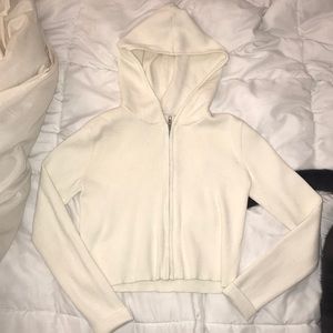 Cream Sweater Cropped Hoodie from Brandy Melville